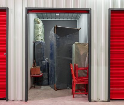 Corridor,Of,Self,Storage,Unit,With,Red,Doors.,Rental,Storage